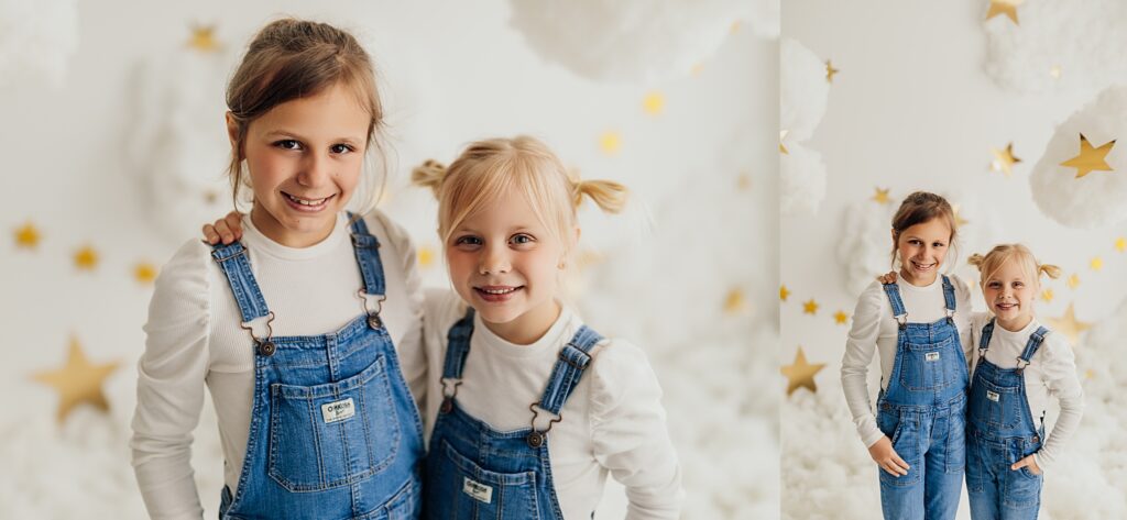 Two sisters posing and having fun in a studio cloud mini session