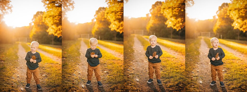 A young boy poses for a photo at sunset while holding a fall leaf