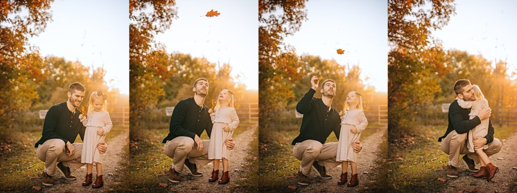 a father snuggles and plays with leaves with his young daughter at sunset