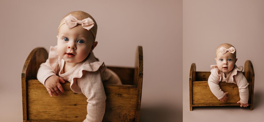 A six-month-old baby captured during a milestone photo session
