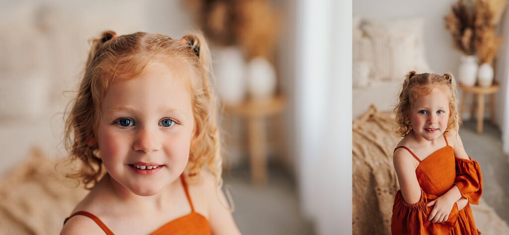 Portrait of a young girl smiling during a motherhood photography session in a Cedar Falls, Iowa studio.