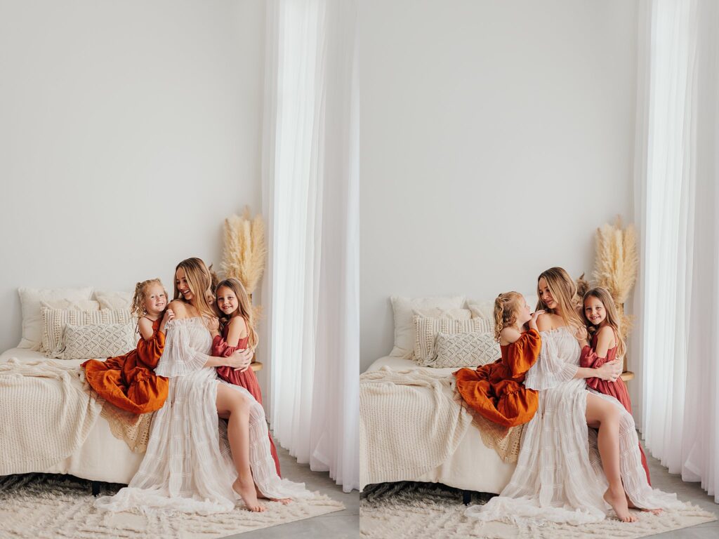 Mother and her two daughters sharing sweet moments during a Mommy and Me session in a Cedar Falls, Iowa studio